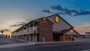 A motel with a brick facade, multiple balconies, and a sign indicating it is a Super 8 hotel. - Super 8 by Wyndham Goodland (Goodland)