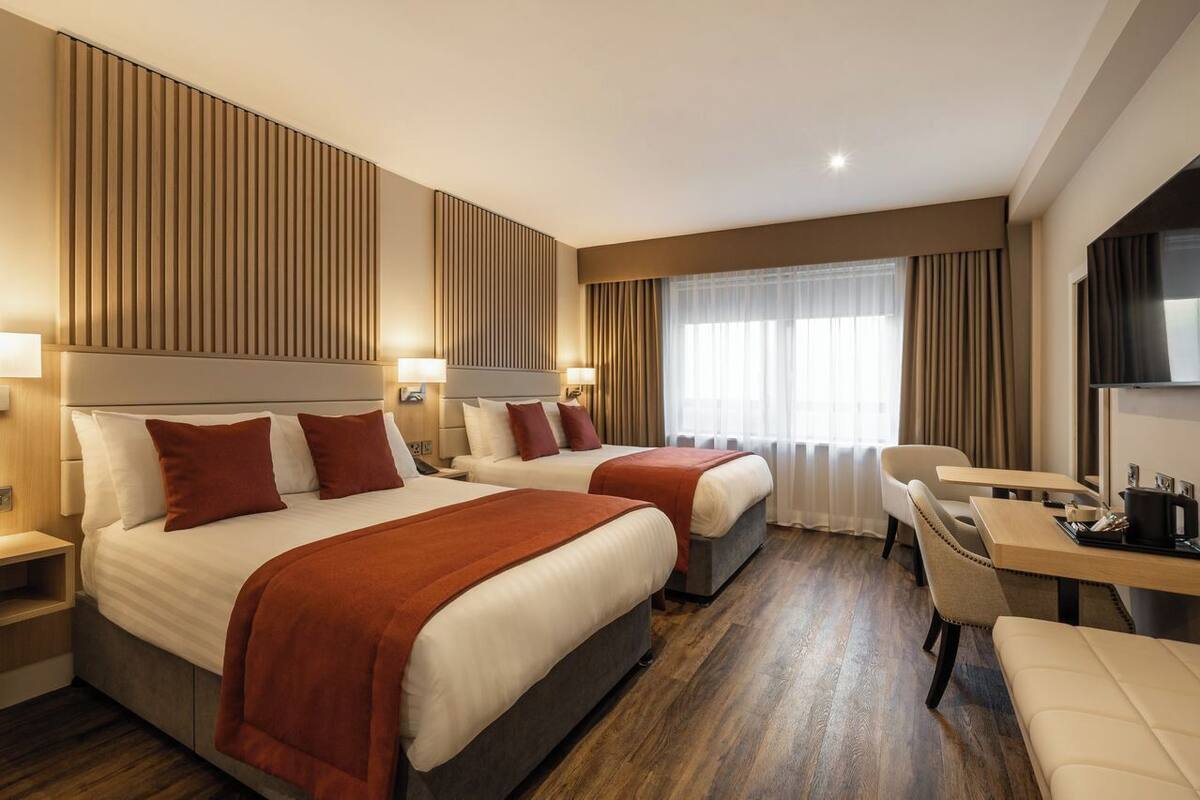 standard double or twin room | in-room safe, desk, iron/ironing board, rollaway beds