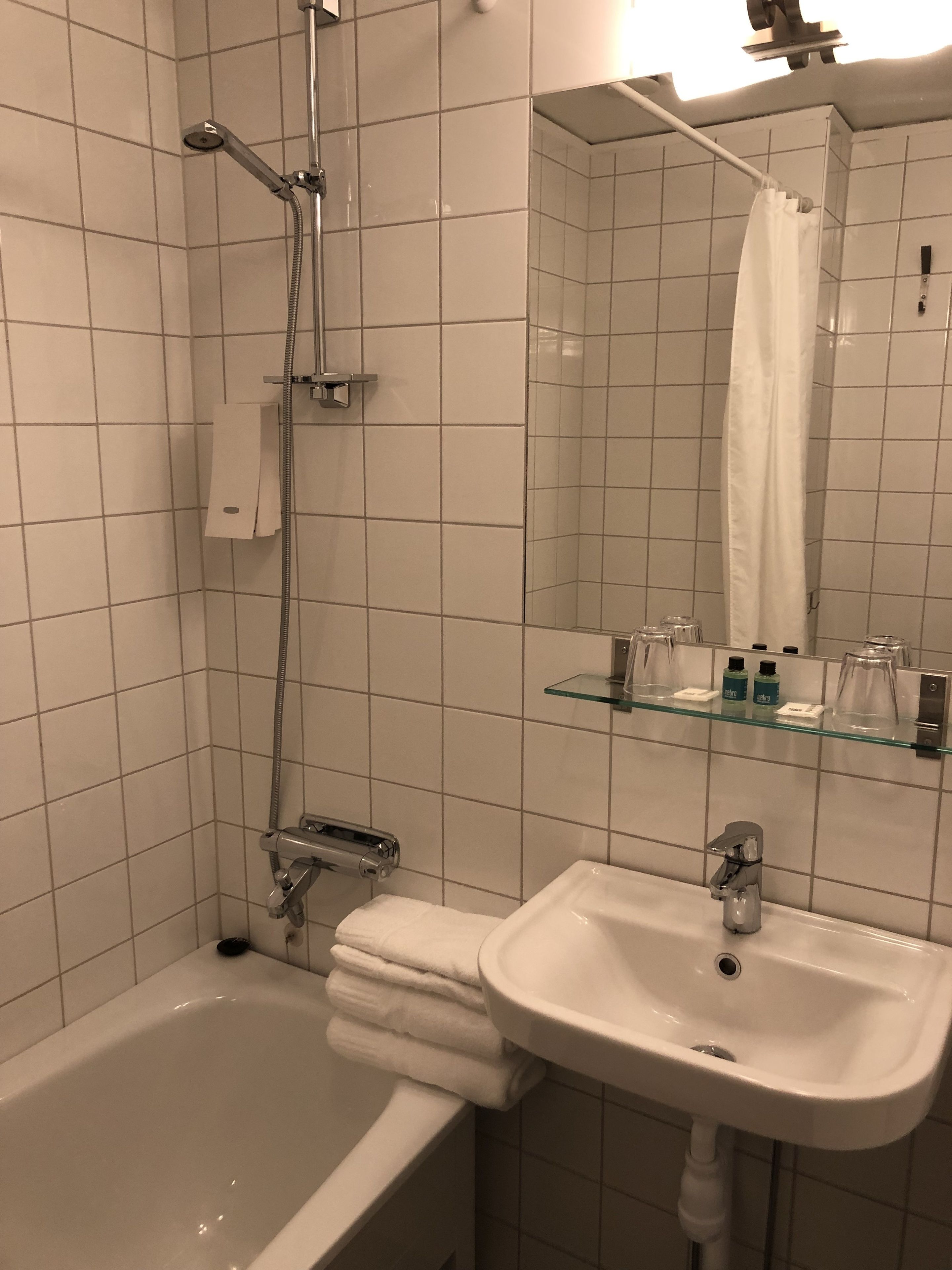 superior double room | bathroom | hair dryer, towels