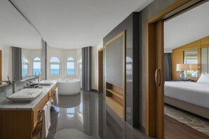 A modern hotel bathroom with a bathtub, two sinks, and a large mirror. - Papillon Zeugma Relaxury (Serik)