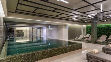 Indoor pool, outdoor pool, pool umbrellas, sun loungers