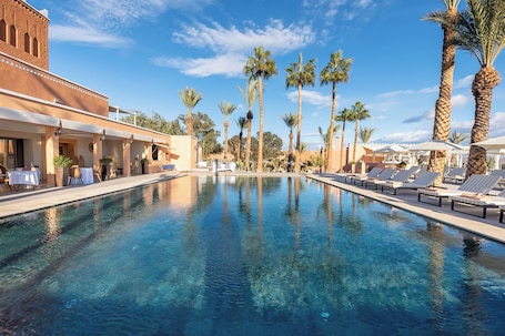 Outdoor pool, pool umbrellas. Kenzi Azghor