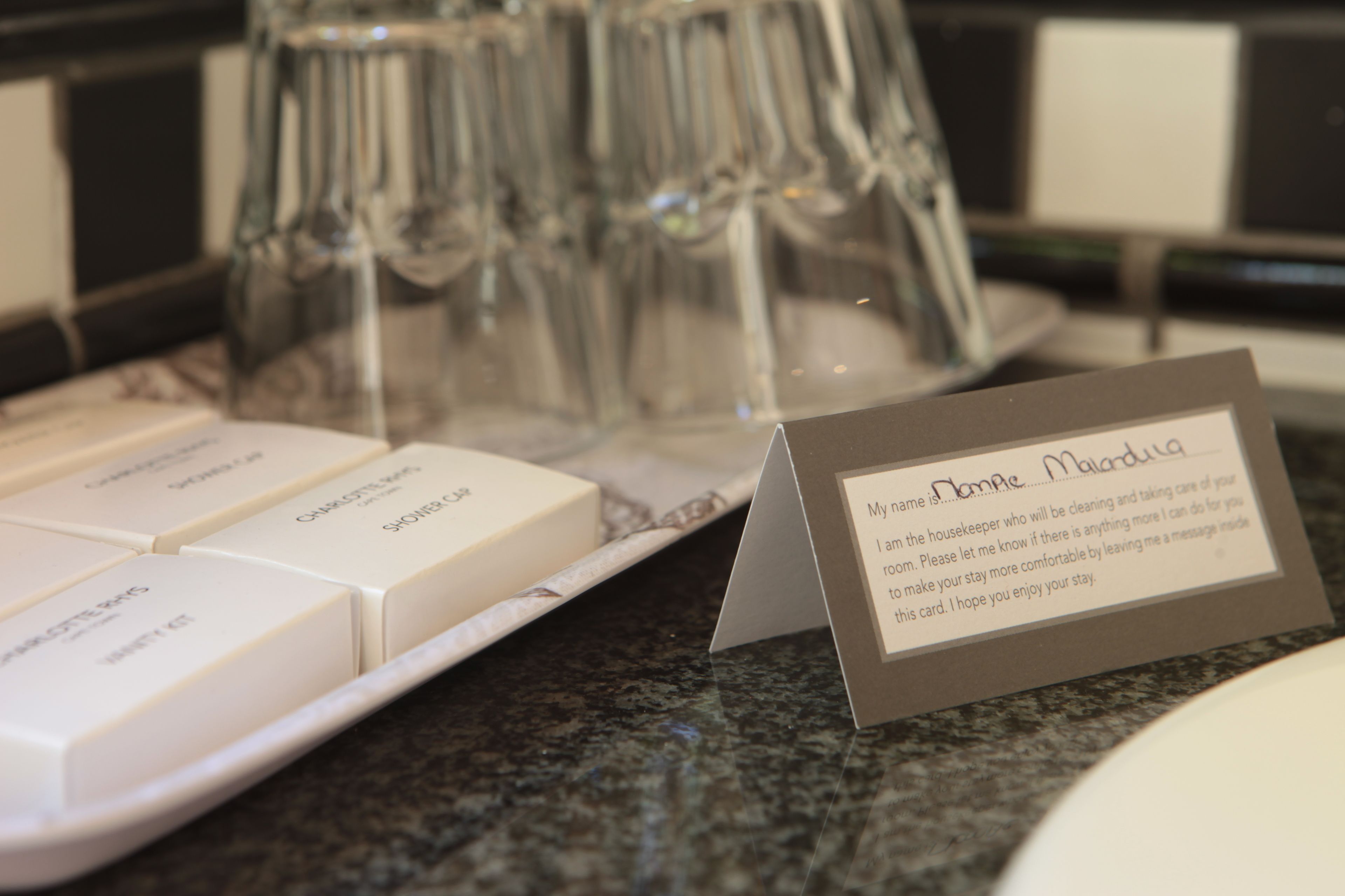 designer toiletries, hair dryer, towels