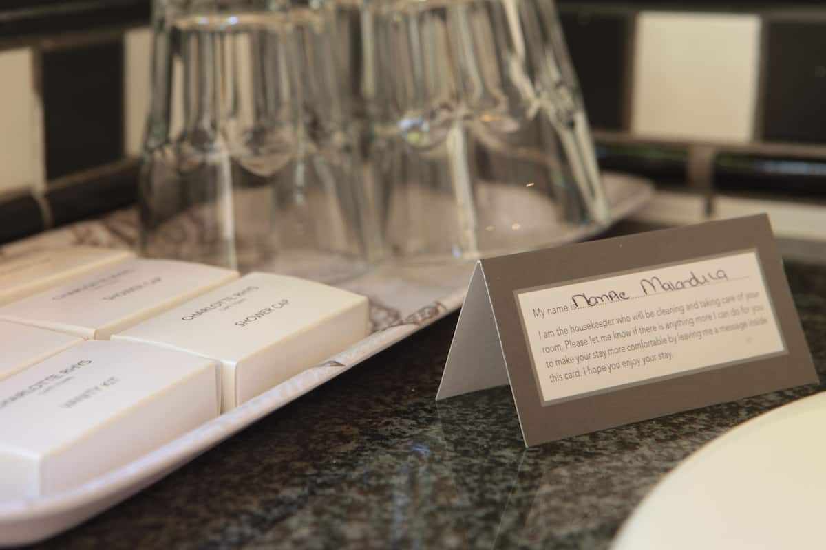 designer toiletries, hair dryer, towels