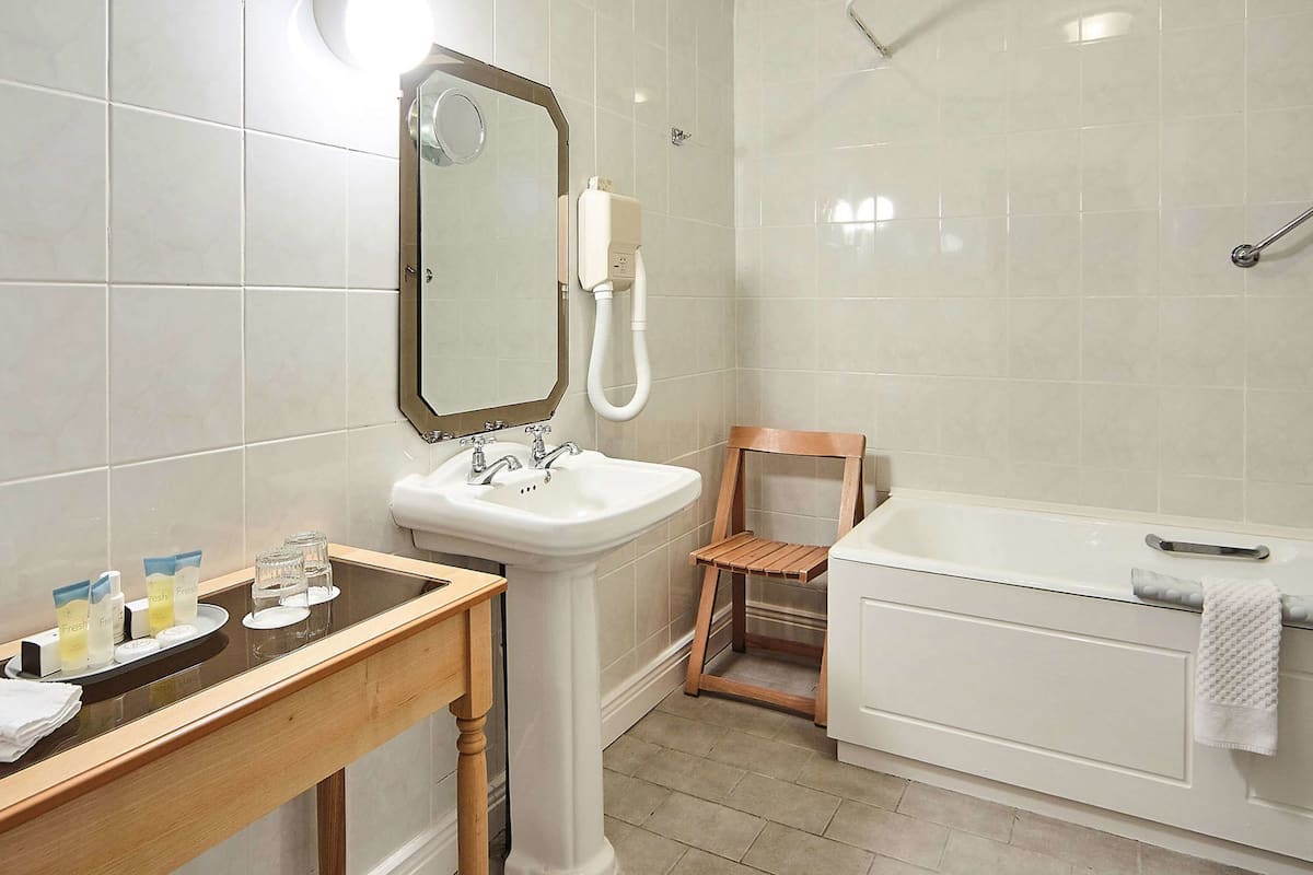 combined shower/bathtub, free toiletries, hair dryer, bathrobes