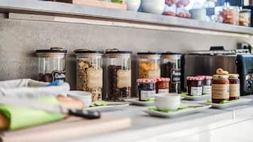 A breakfast buffet with various food items and condiments.