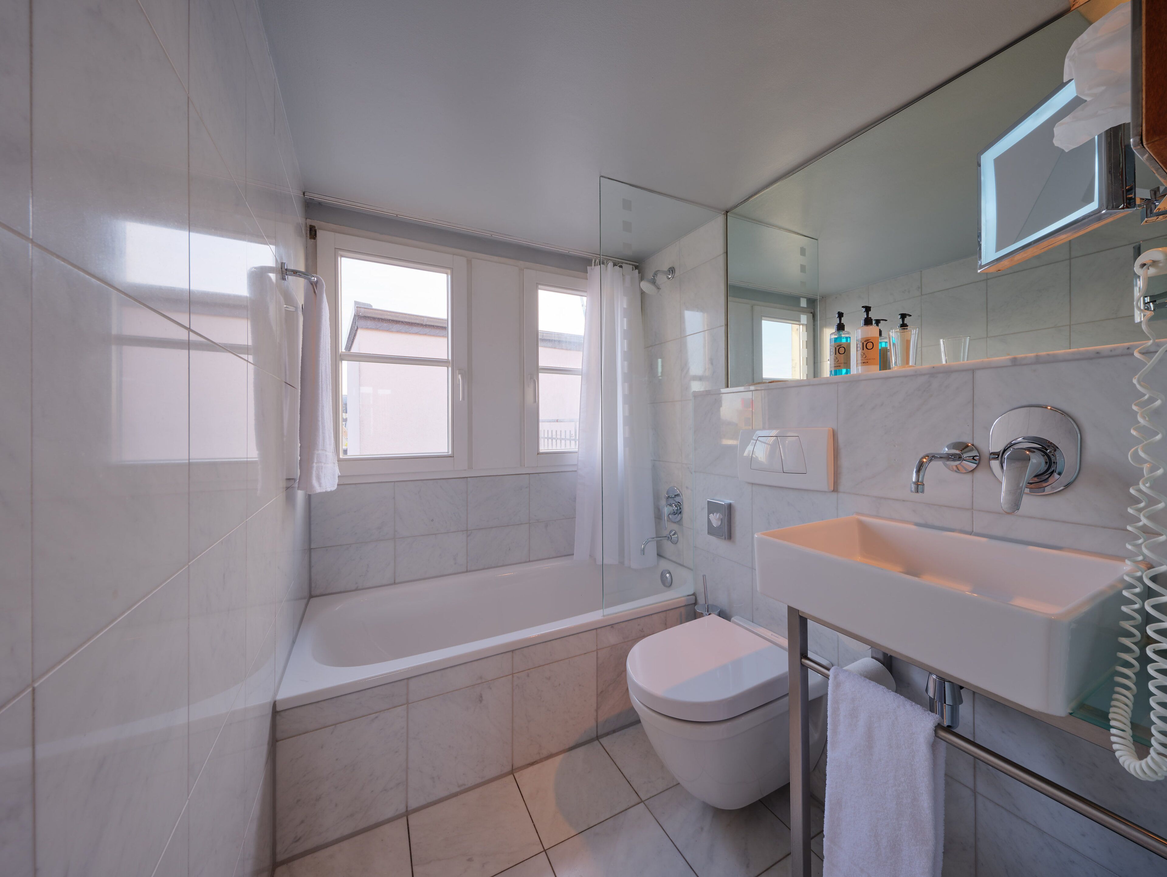 classic single room | bathroom | eco-friendly toiletries, hair dryer, heated floors, towels