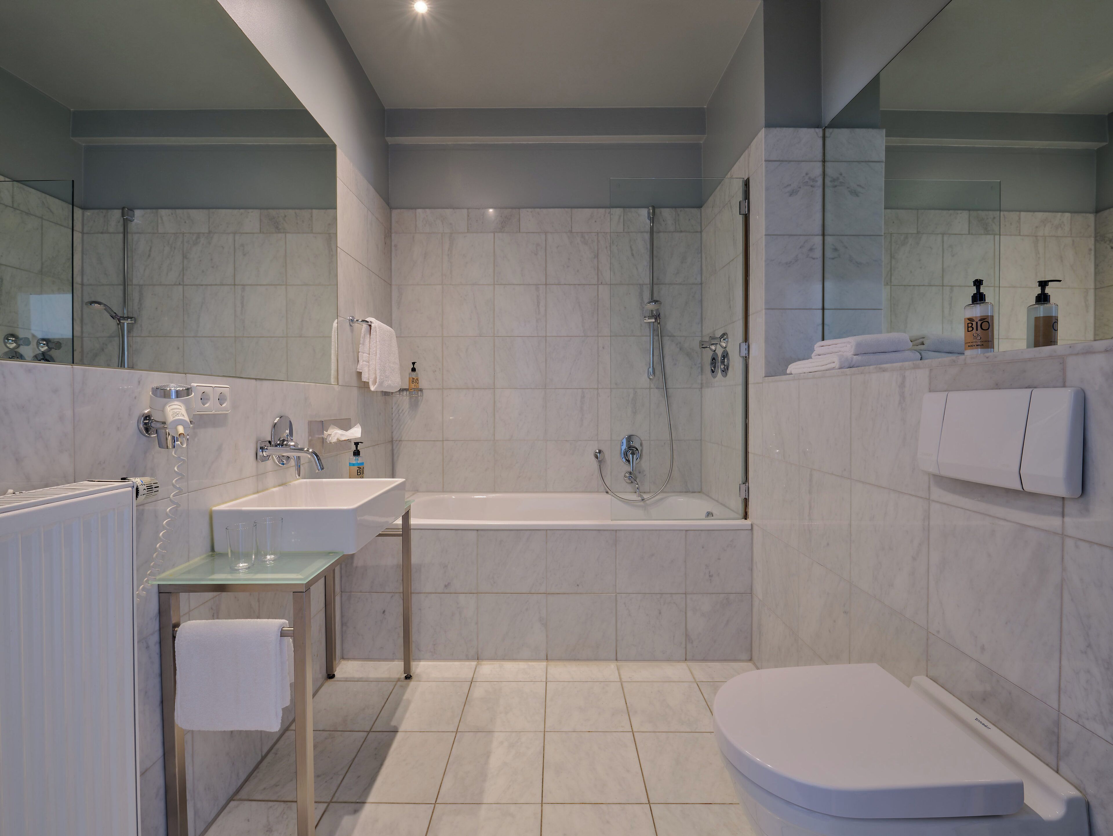 premium room | bathroom | eco-friendly toiletries, hair dryer, heated floors, towels