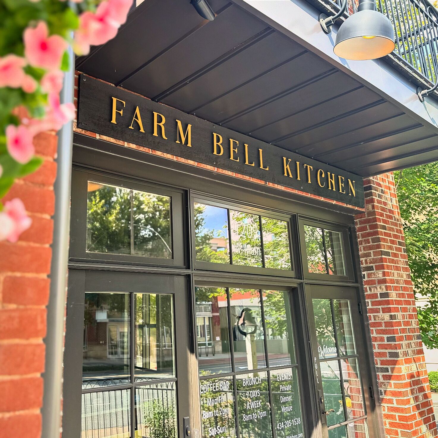 A storefront with a sign reading "Farm Bell Kitchen".