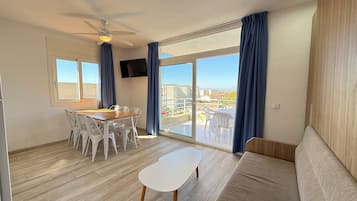 Apartment, 2 Bedrooms | Living area | 32-inch TV with satellite channels