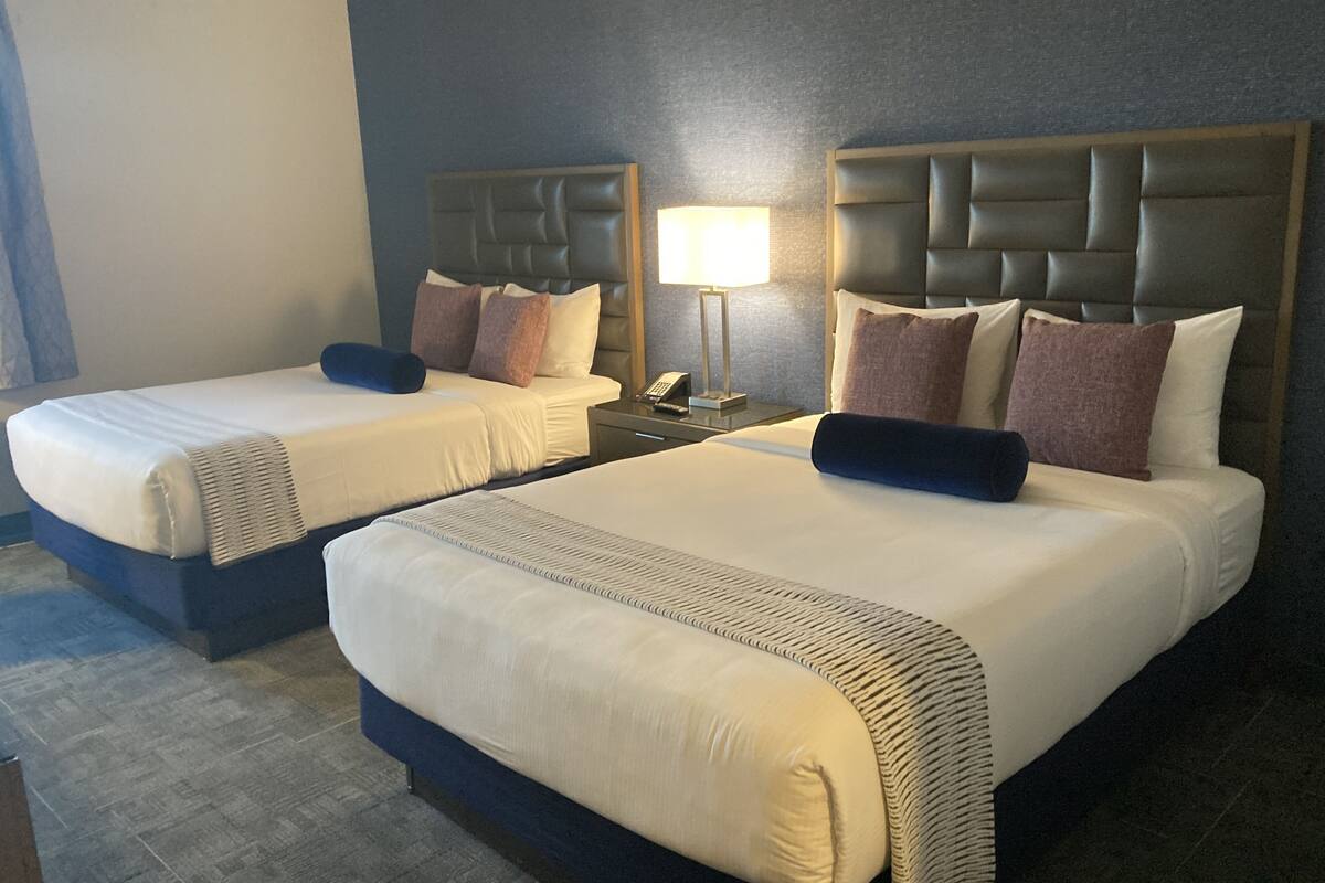 traditional room, 2 queen beds | in-room safe, iron/ironing board, free cots/infant beds, rollaway beds