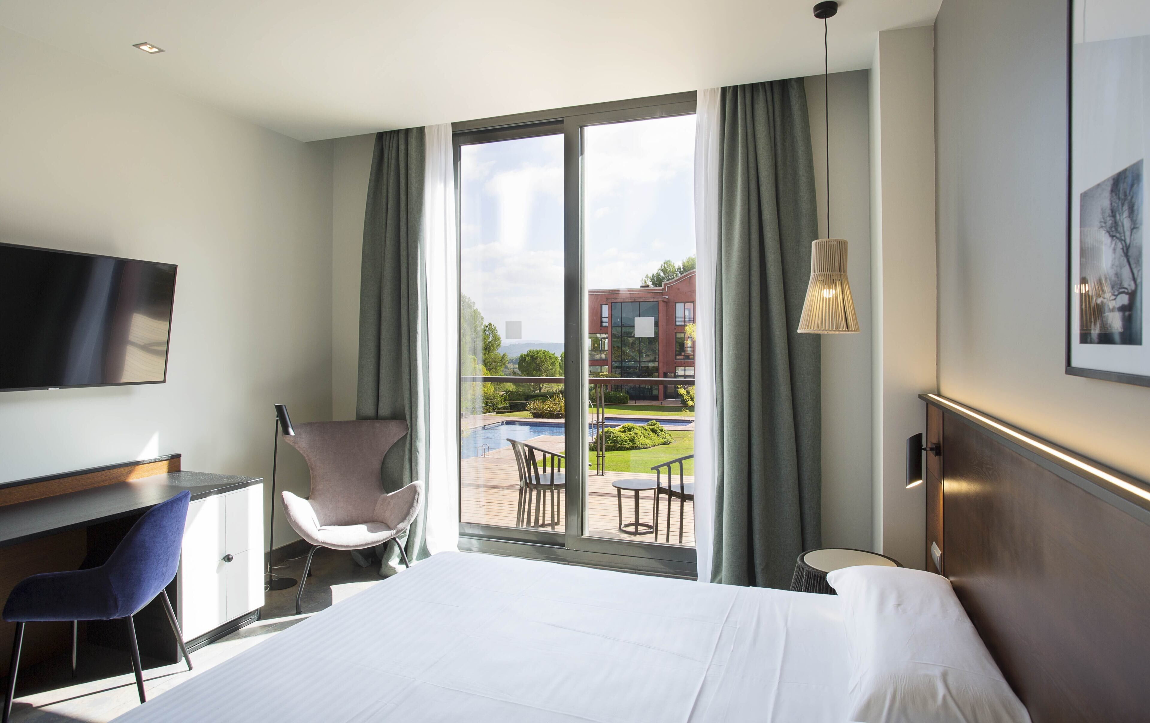 deluxe double or twin room, 1 bedroom, terrace, pool view | minibar, in-room safe, desk, laptop workspace