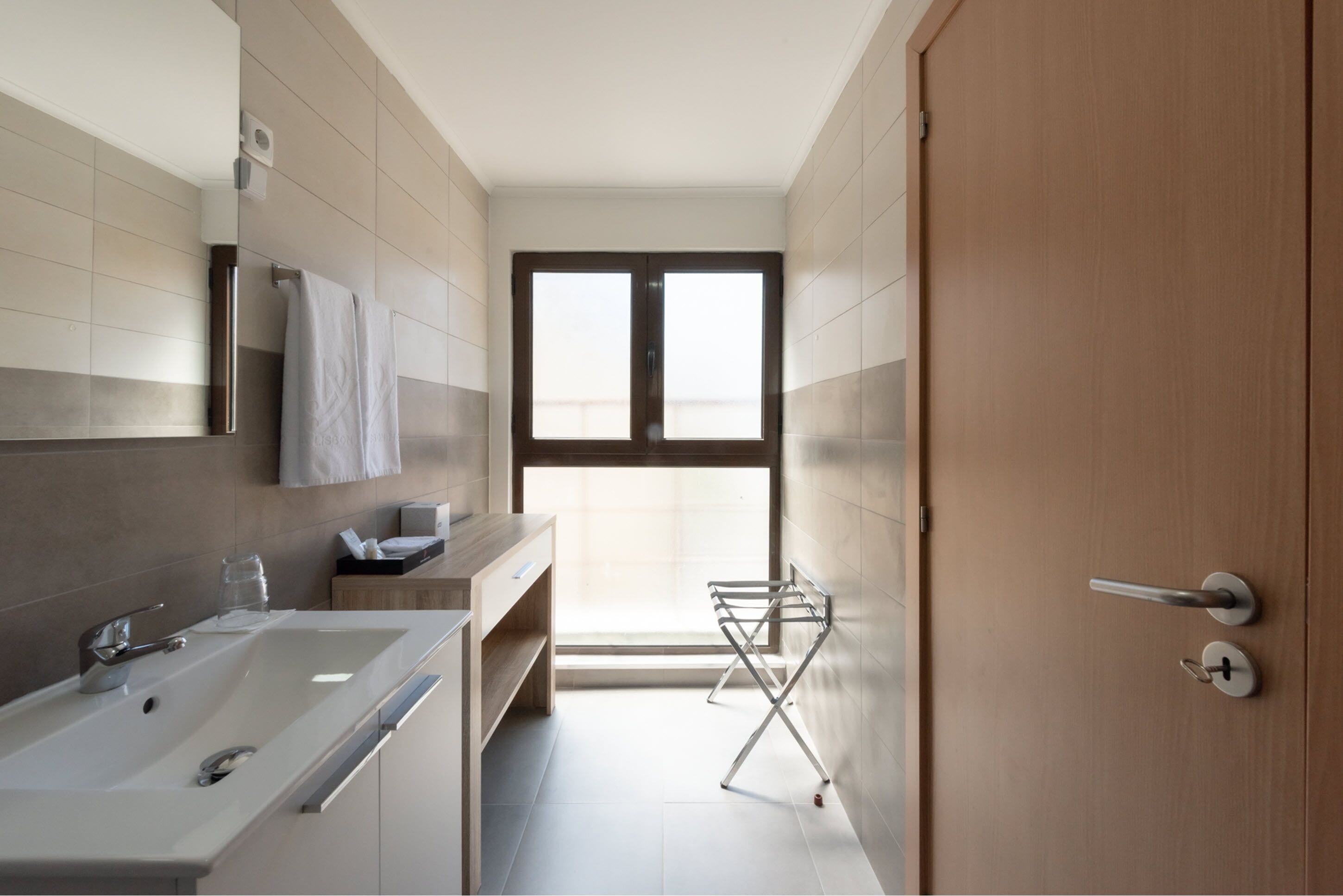 rainfall showerhead, designer toiletries, hair dryer, towels