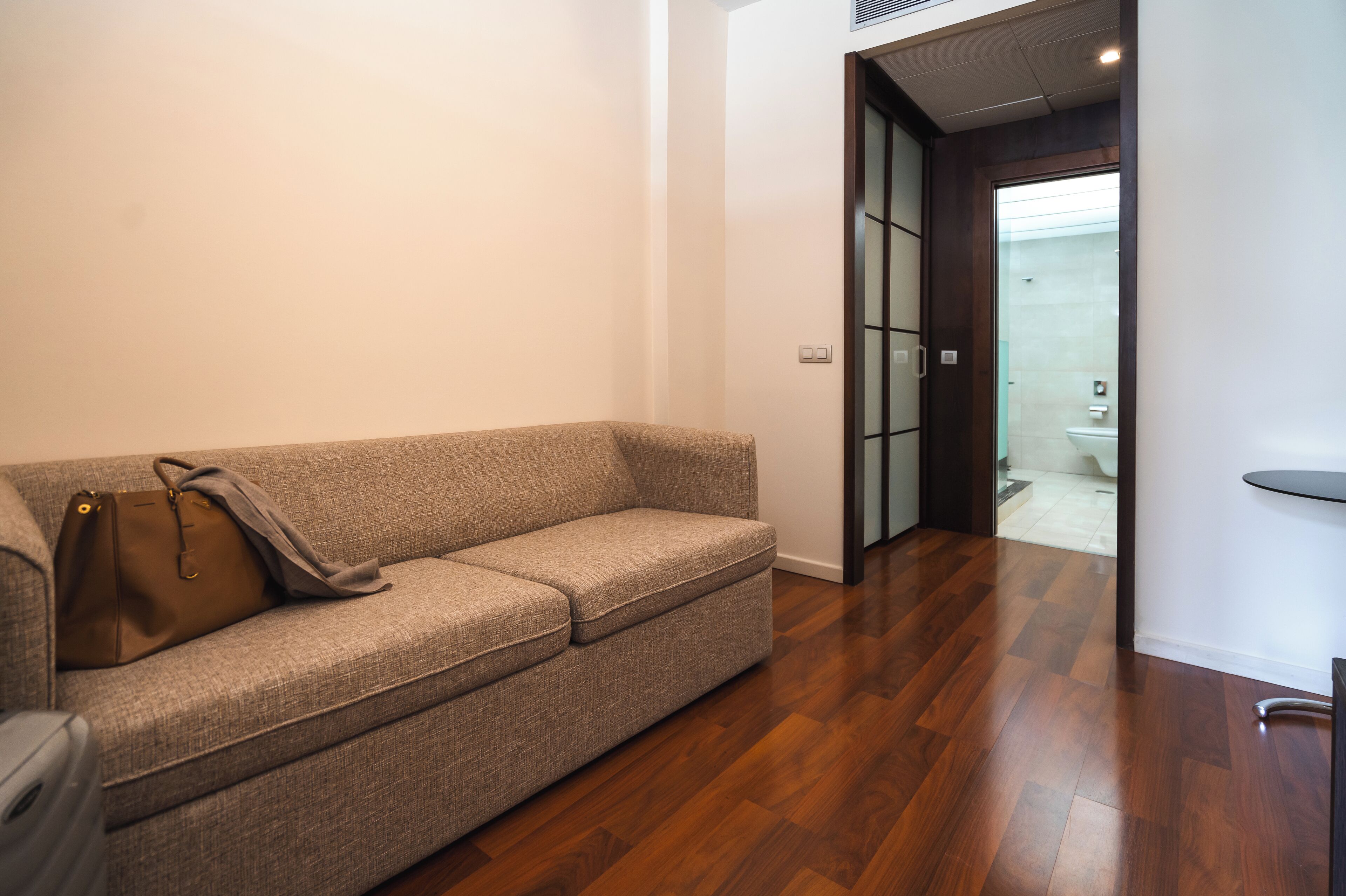 superior triple room | living area | tv