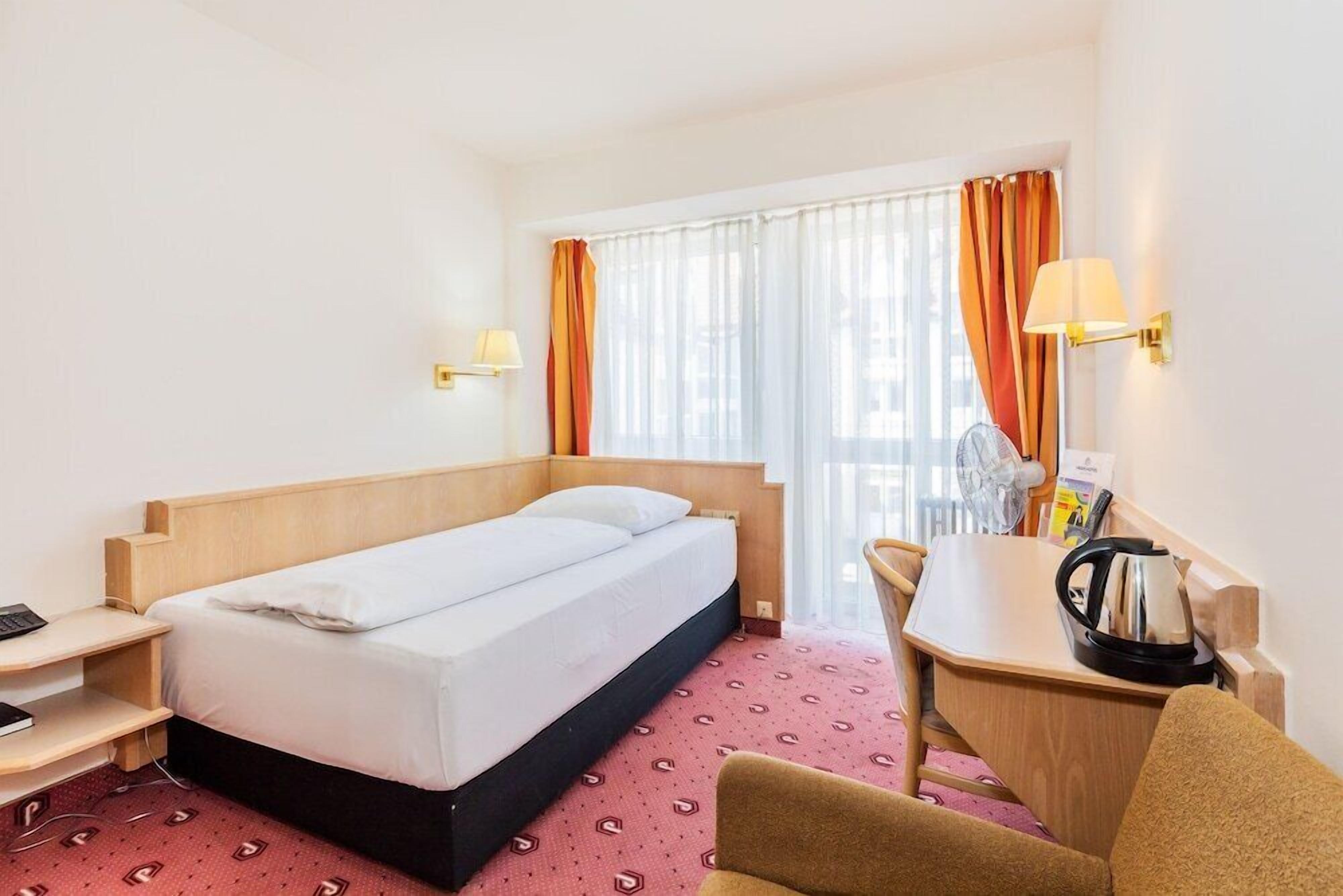 Premium bedding, memory-foam beds, minibar, in-room safe