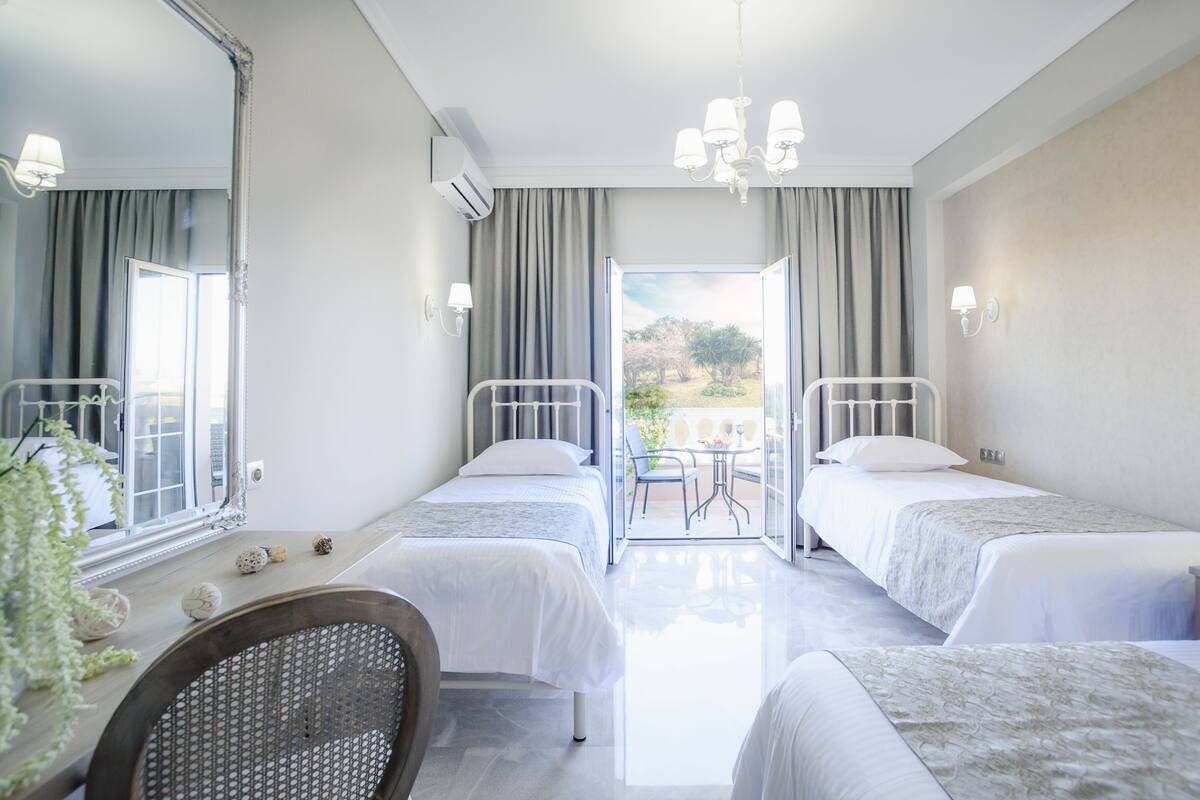 Superior Triple Room, Garden View | In-room safe, desk, WiFi (free), bed sheets