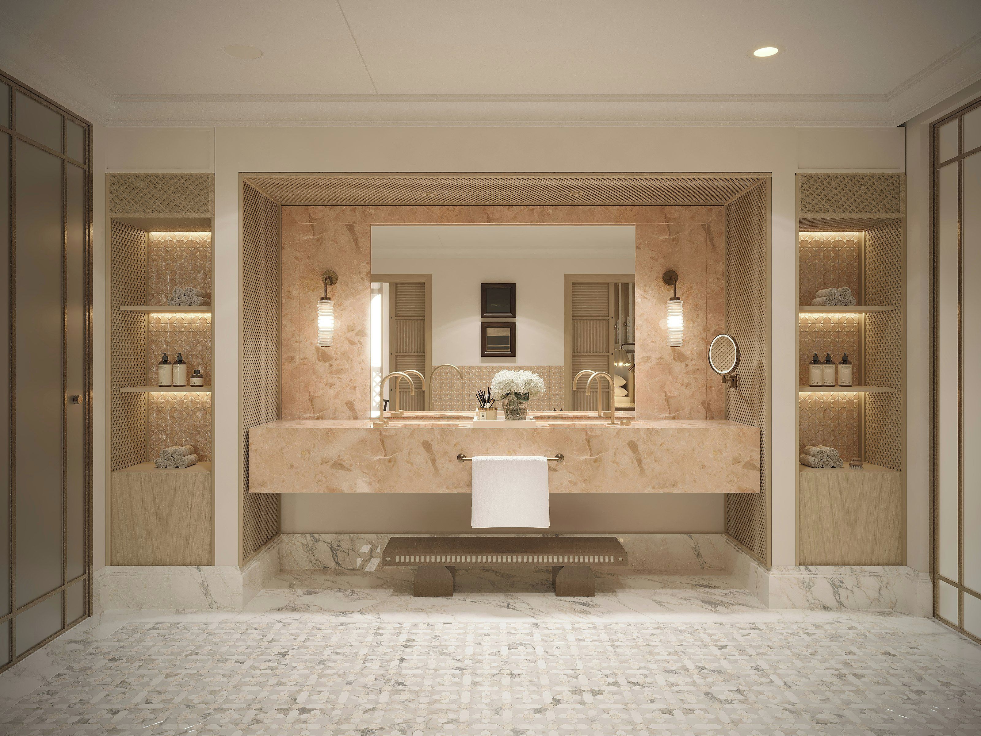 Une salle de bain dotée d’un grand miroir, de plans de travail en marbre et d’un banc.