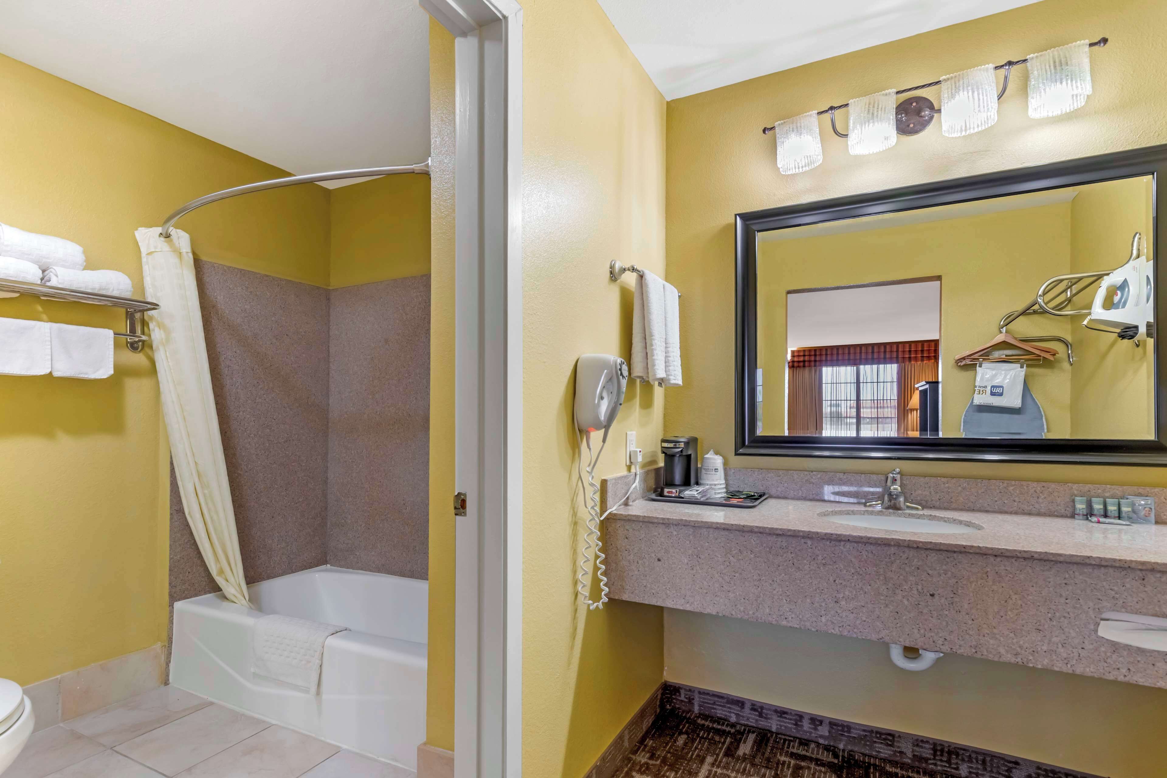 standard room, 1 king bed, non smoking, refrigerator & microwave | bathroom | hair dryer, towels