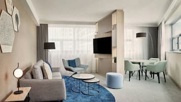 Apartment, 1 King Bed with Sofa bed | Living room | 70-cm flat-screen TV with satellite channels, TV