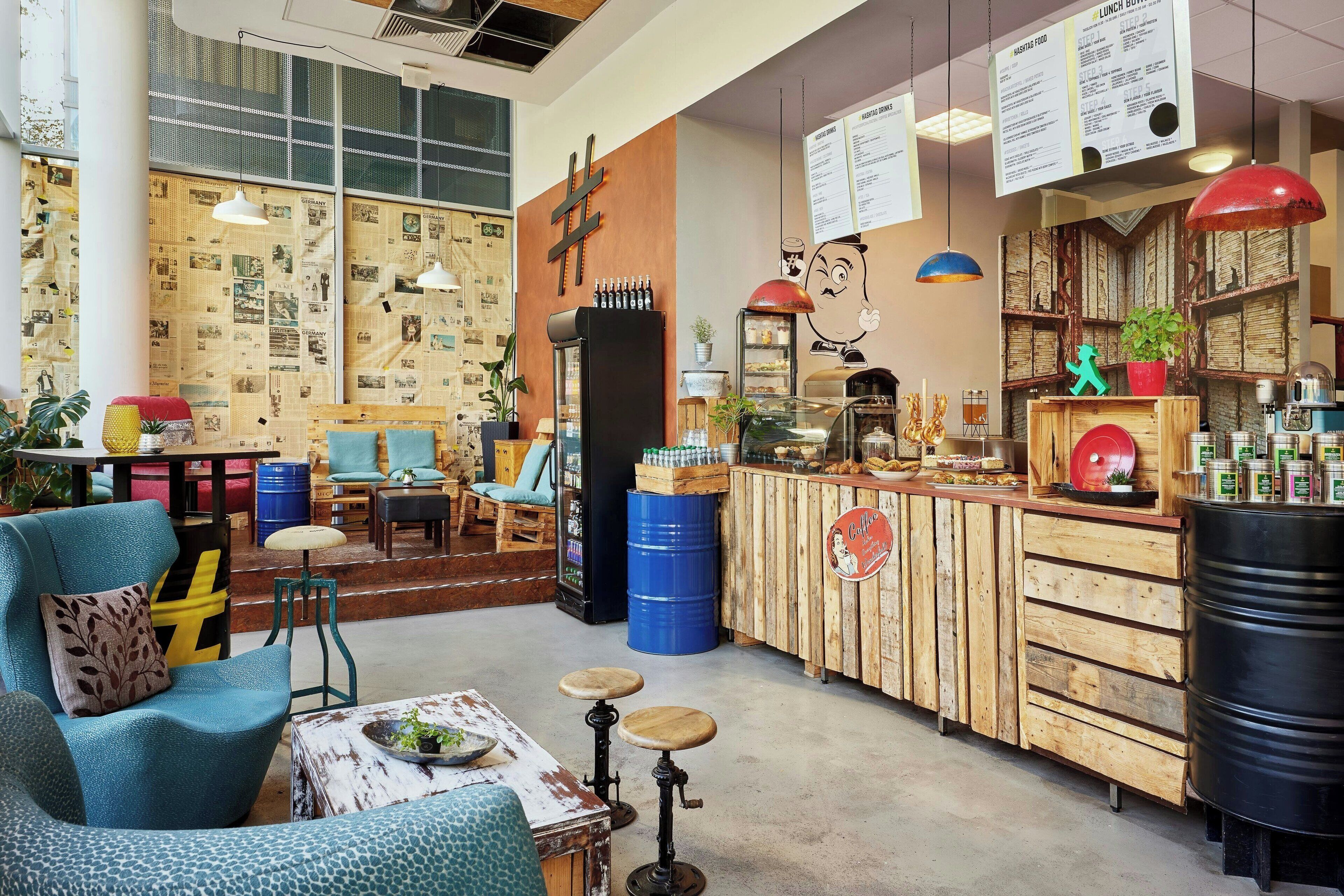 A cozy cafe with wooden furniture, a bar area, and a menu board.