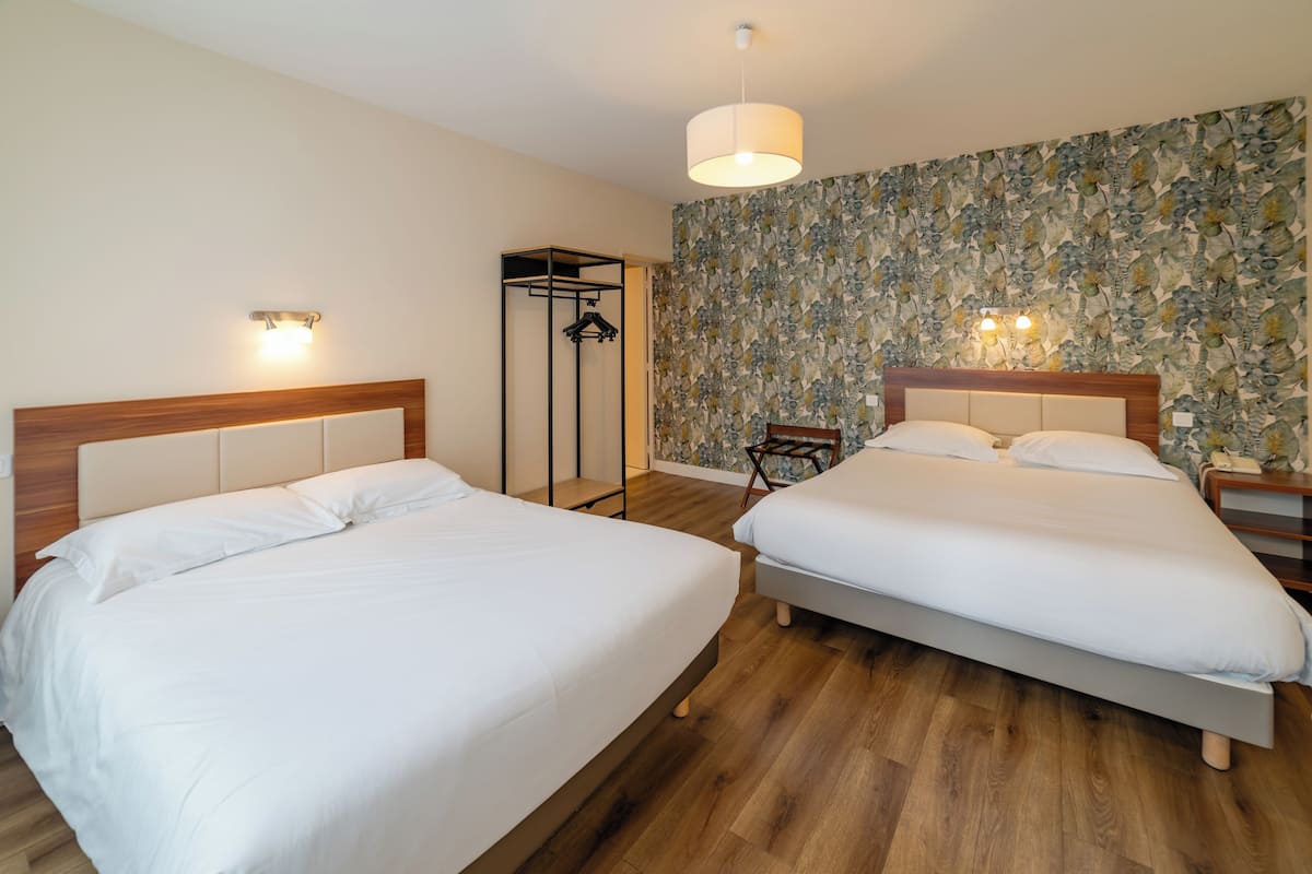 Quadruple Room | Pillowtop beds, in-room safe, individually decorated