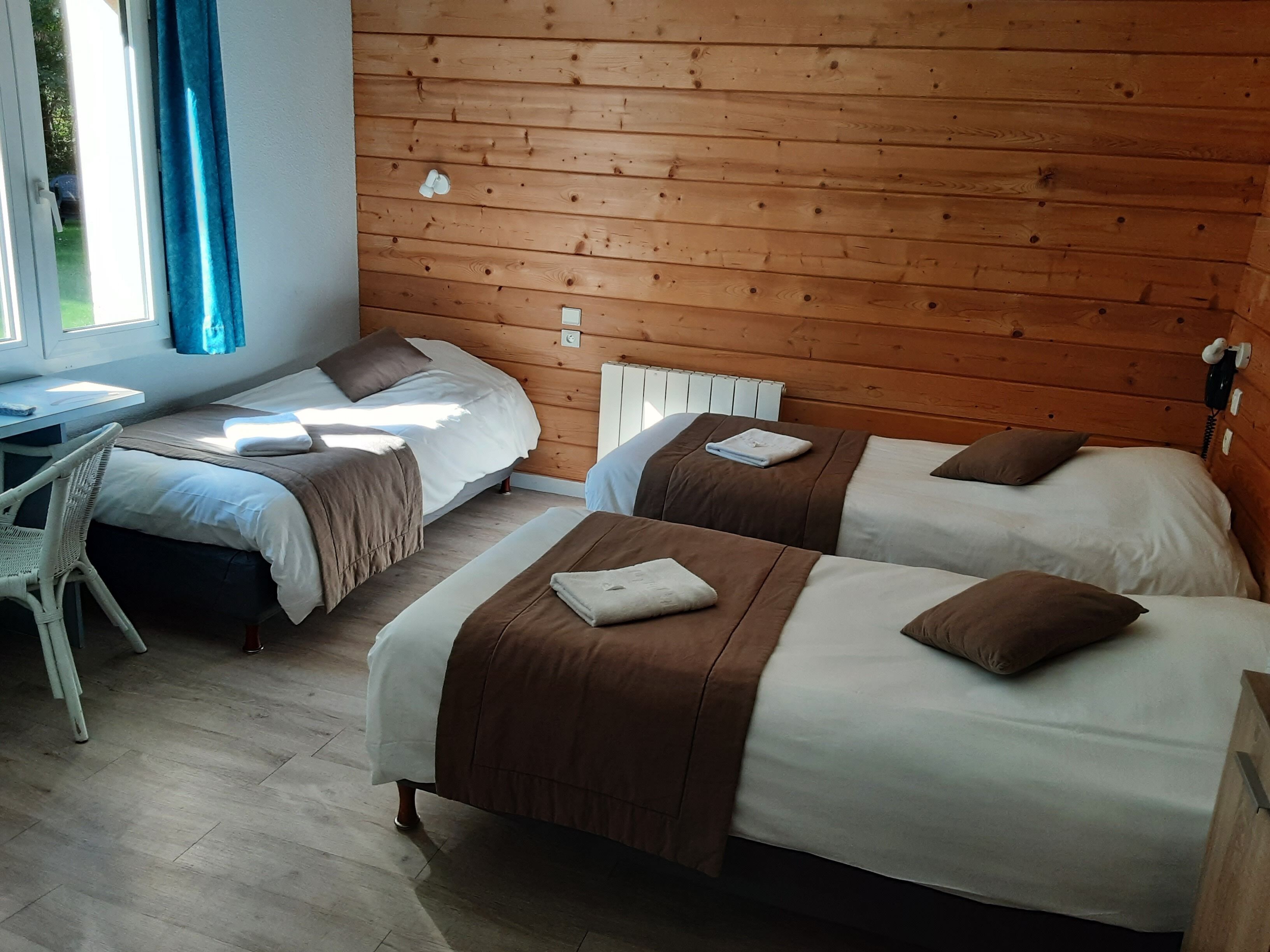 comfort triple room, accessible, garden view | individually decorated, individually furnished, desk, blackout curtains