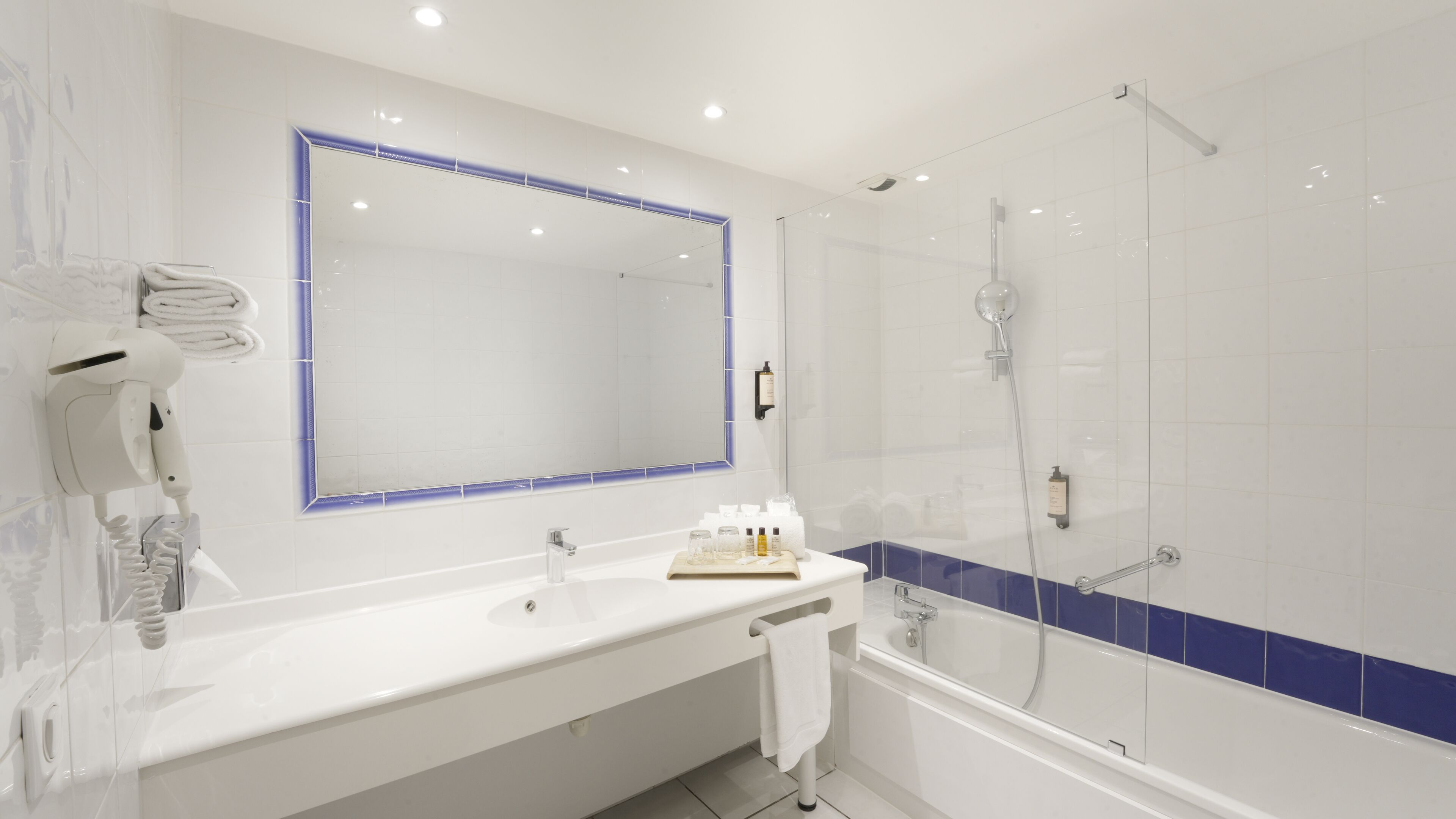 bathtub, free toiletries, hair dryer, towels