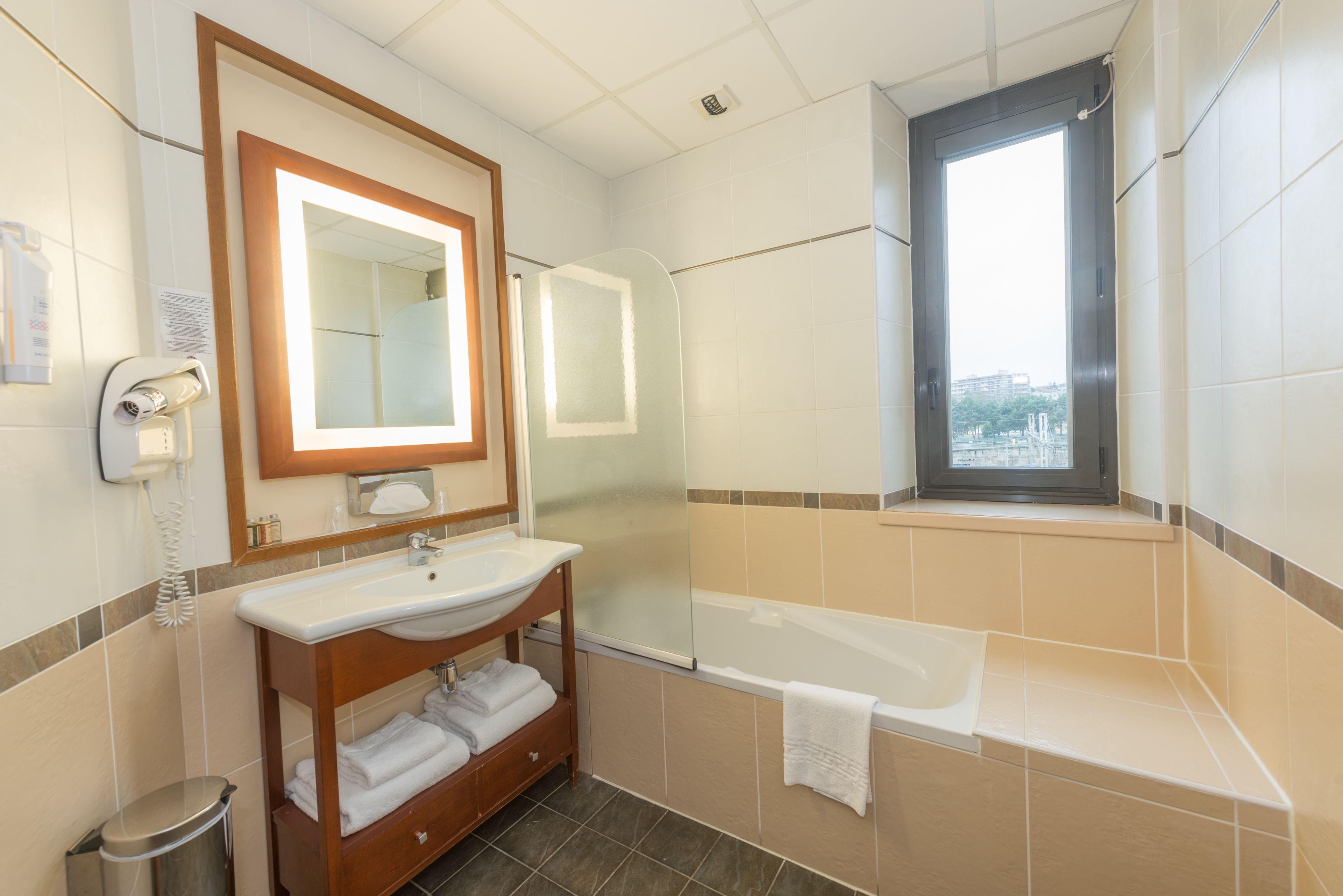 eco-friendly toiletries, hair dryer, towels