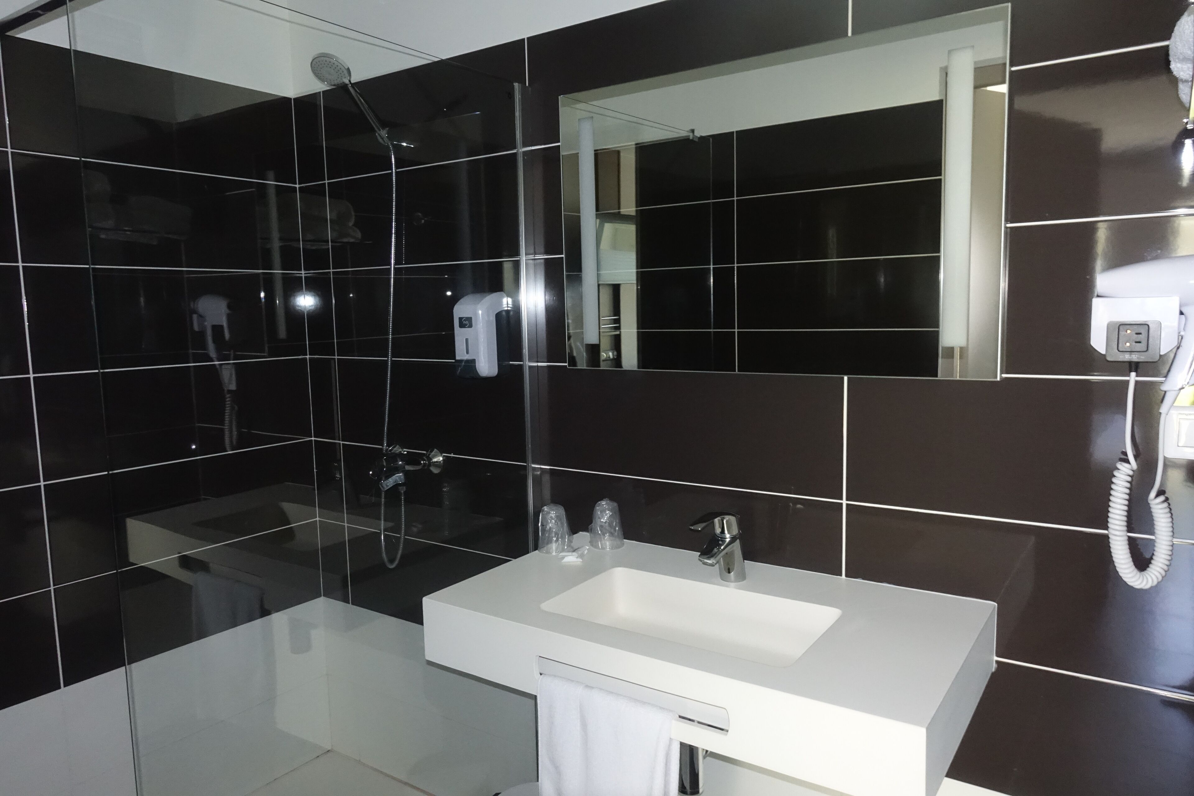 superior double room | bathroom | shower, hair dryer, towels