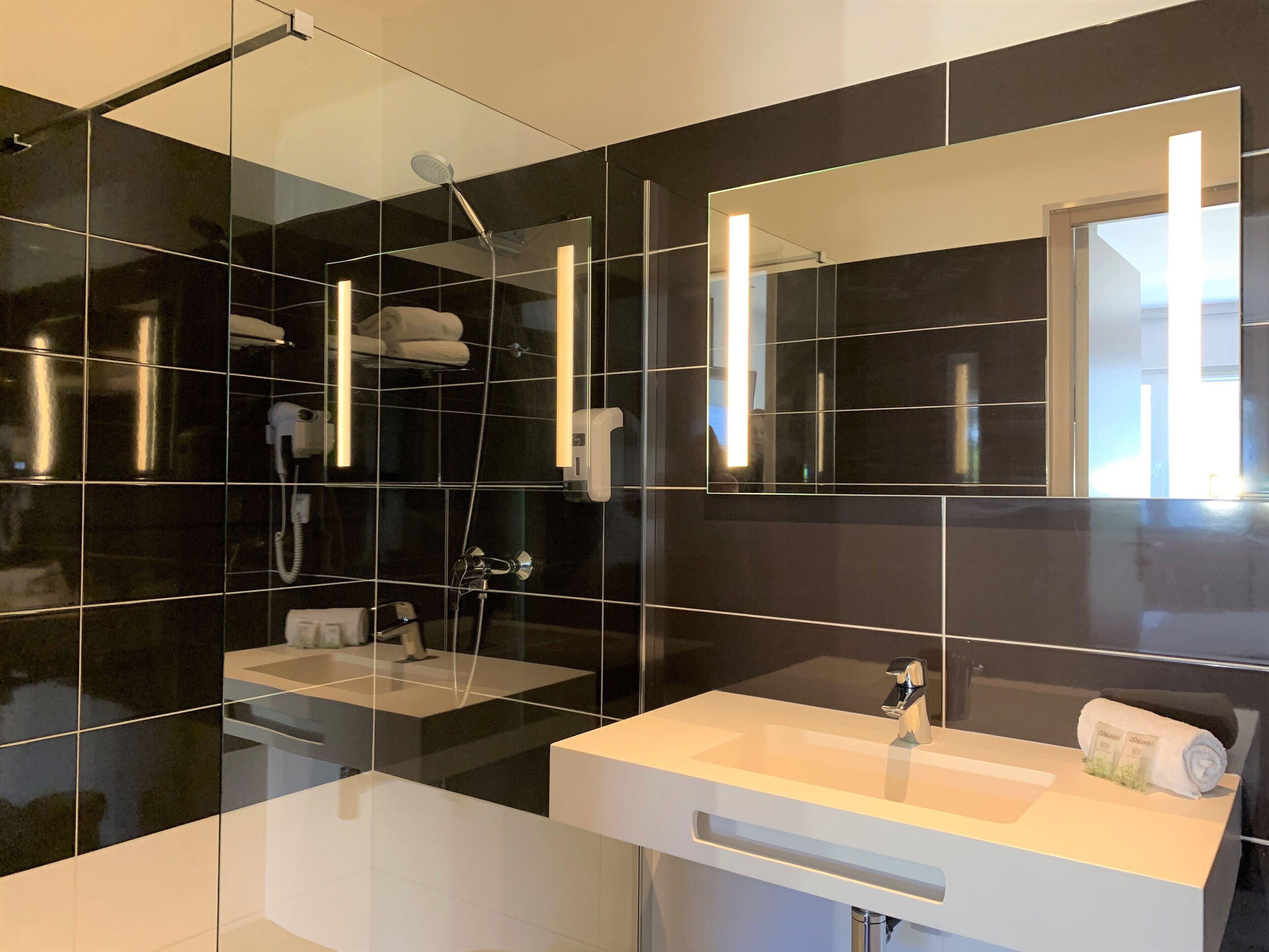 superior double room | bathroom | shower, hair dryer, towels