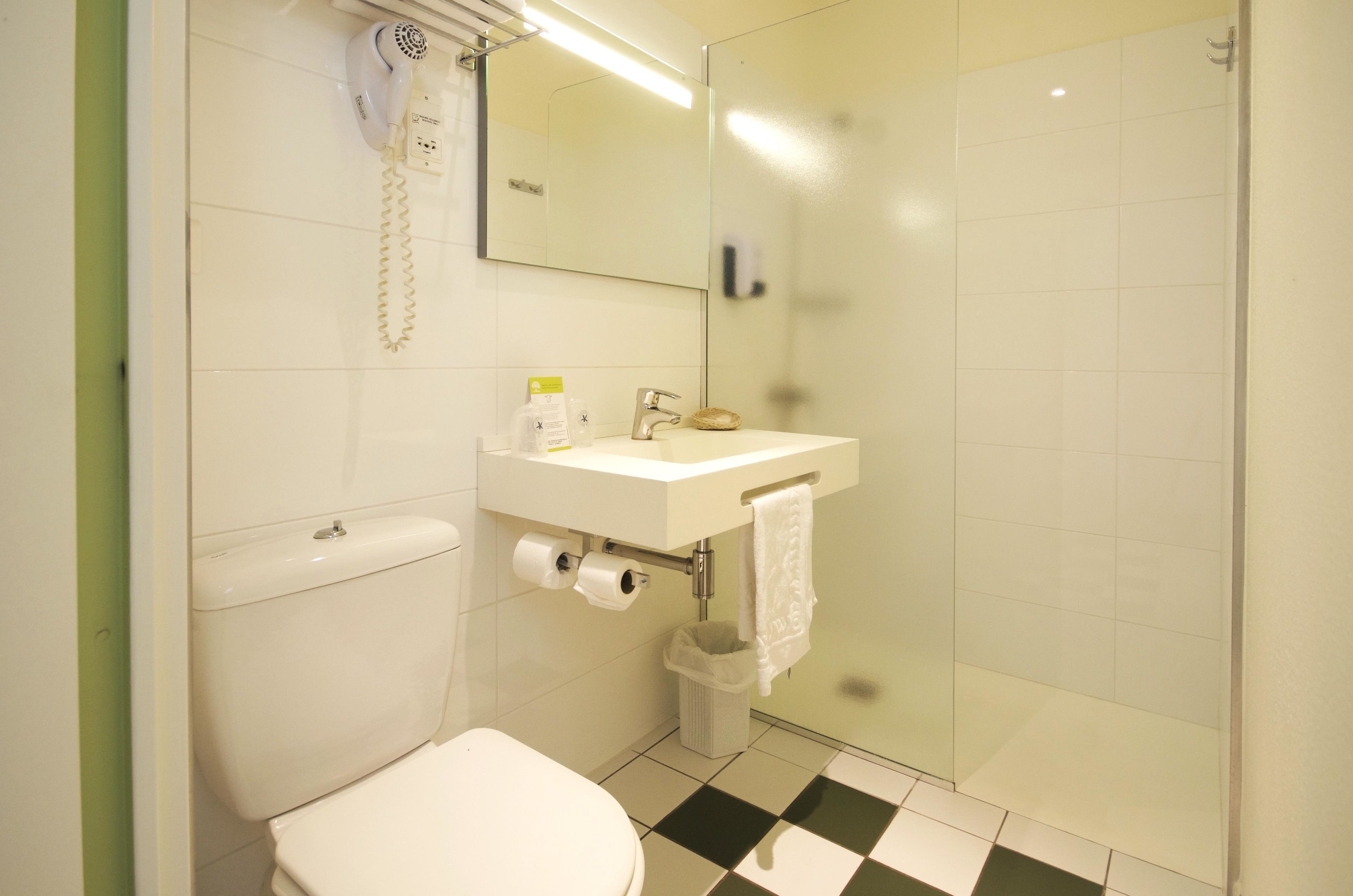 standard double room | bathroom | shower, hair dryer, towels