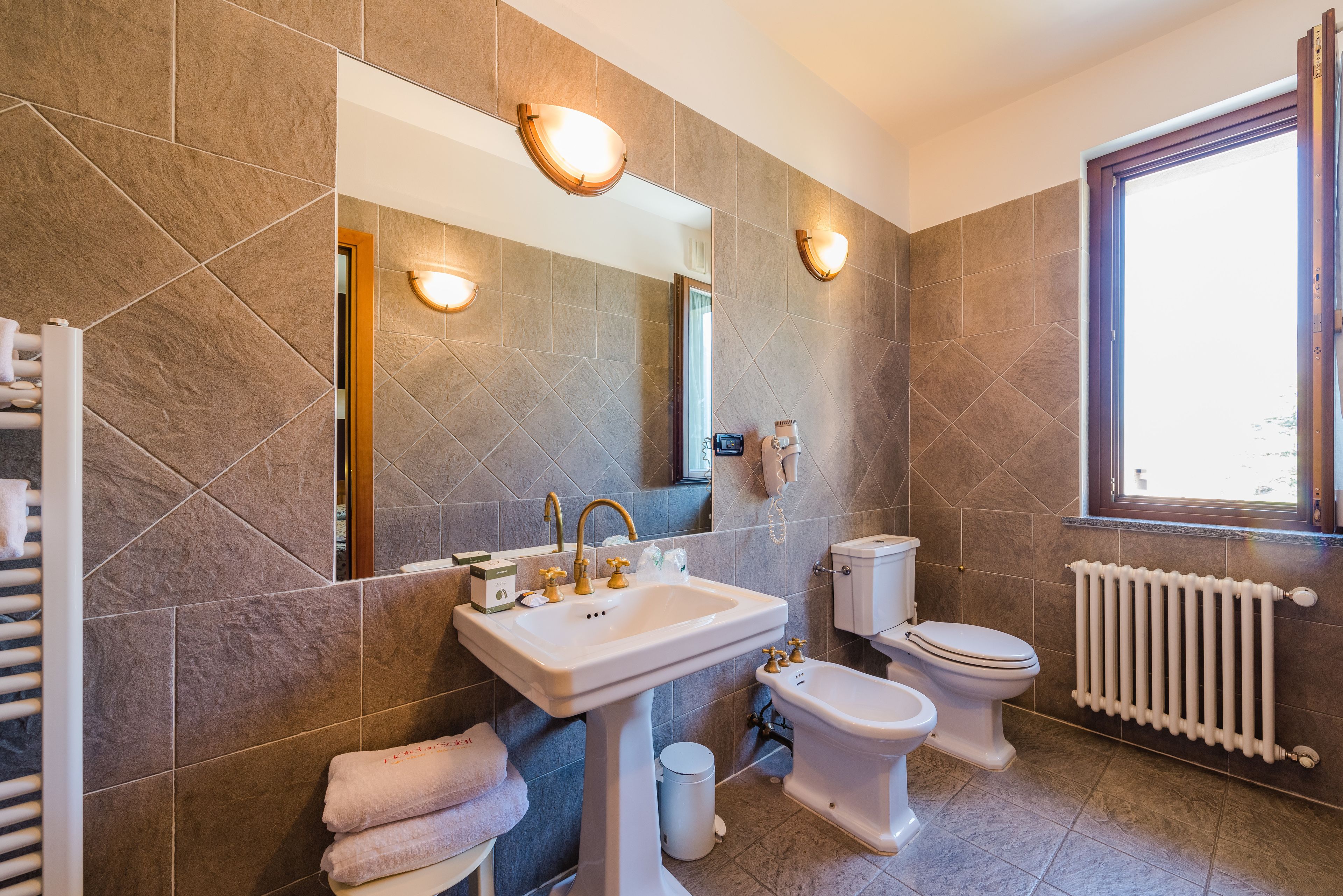 quadruple room | bathroom | free toiletries, hair dryer, bidet, towels