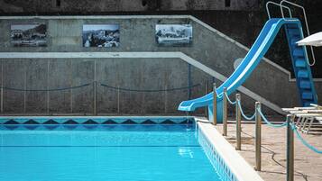 Seasonal outdoor pool, open 9:30 AM to 6:30 PM, pool umbrellas