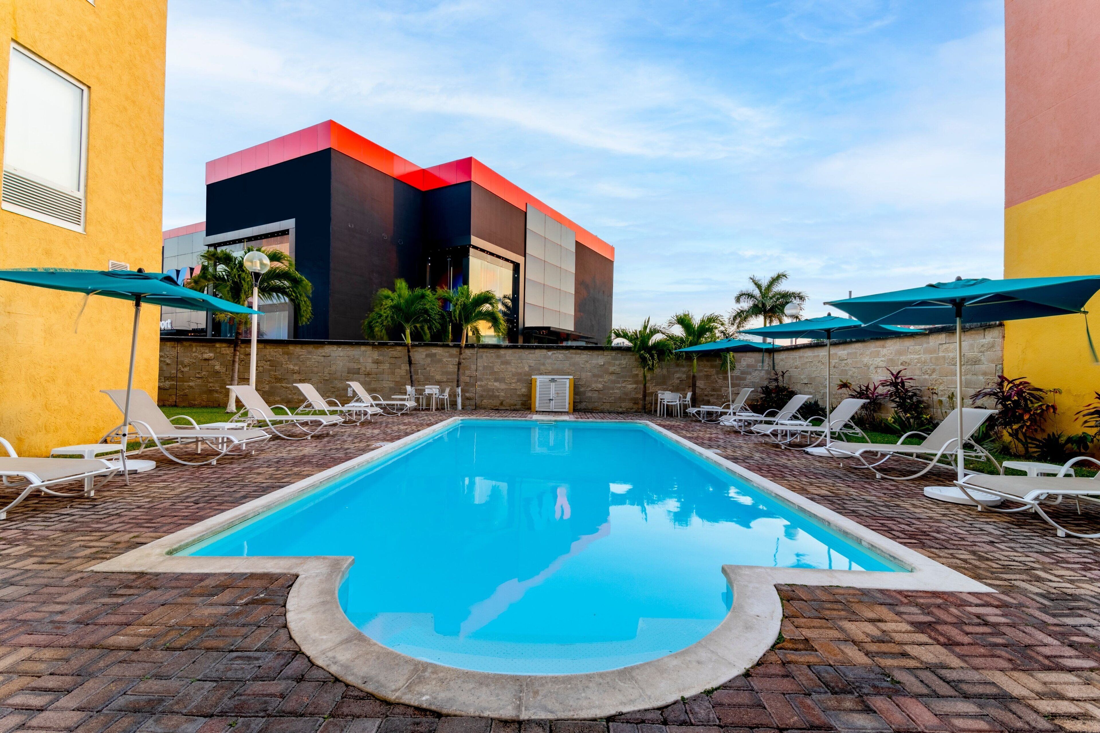 Outdoor pool, open 8:00 AM to 8:00 PM, pool umbrellas, pool loungers