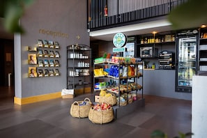 A reception area with a display of books and a sign for 'reception'.