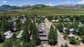A residential area with houses, a prominent Mountain Lodge building, and a road. - Elk Mountain Lodge (Crested Butte)