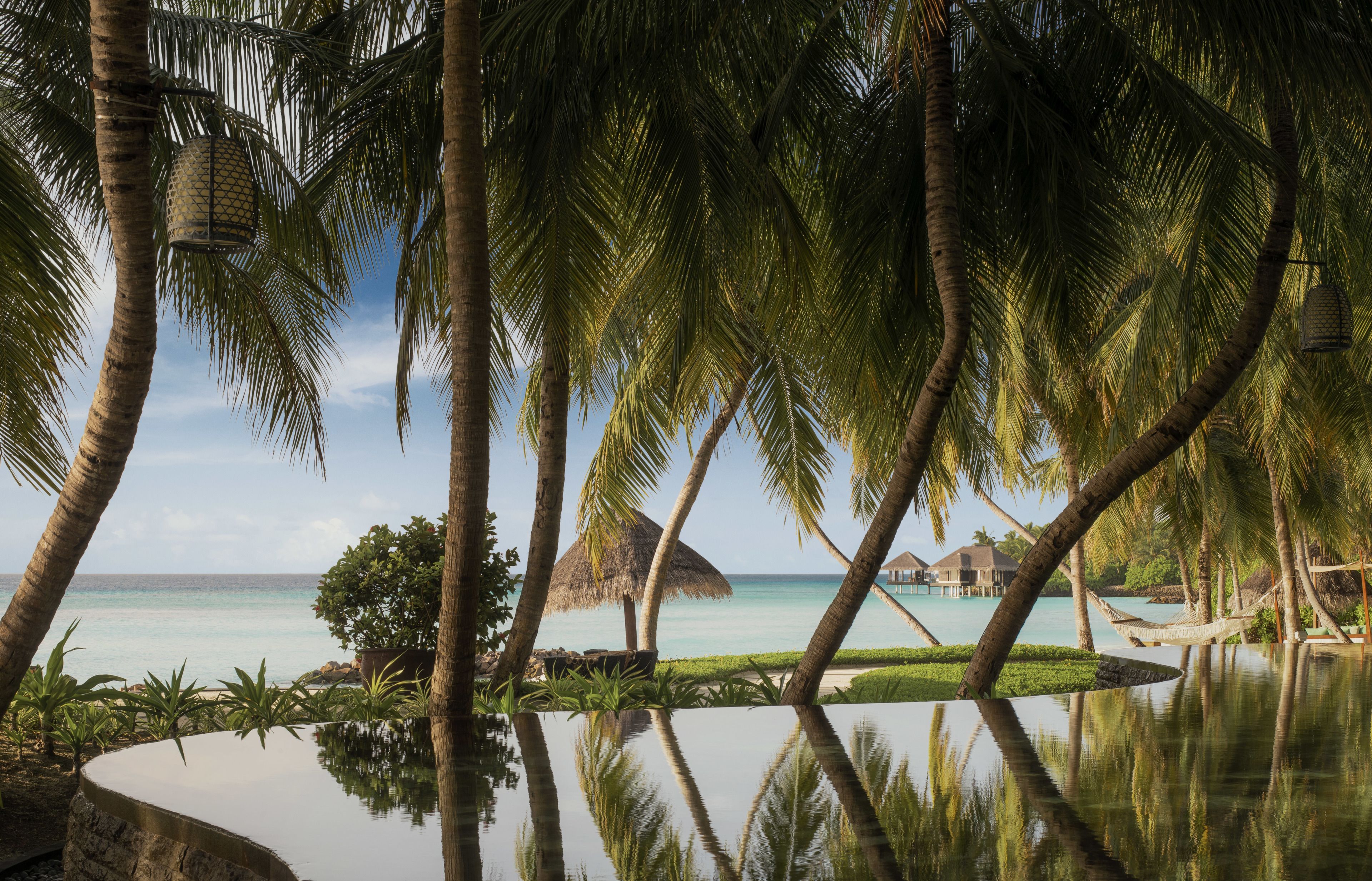 outdoor pool, open 9:00 am to 6:00 pm, pool umbrellas, pool loungers