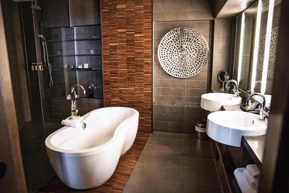 penthouse | bathroom | shower, rainfall showerhead, designer toiletries, hair dryer