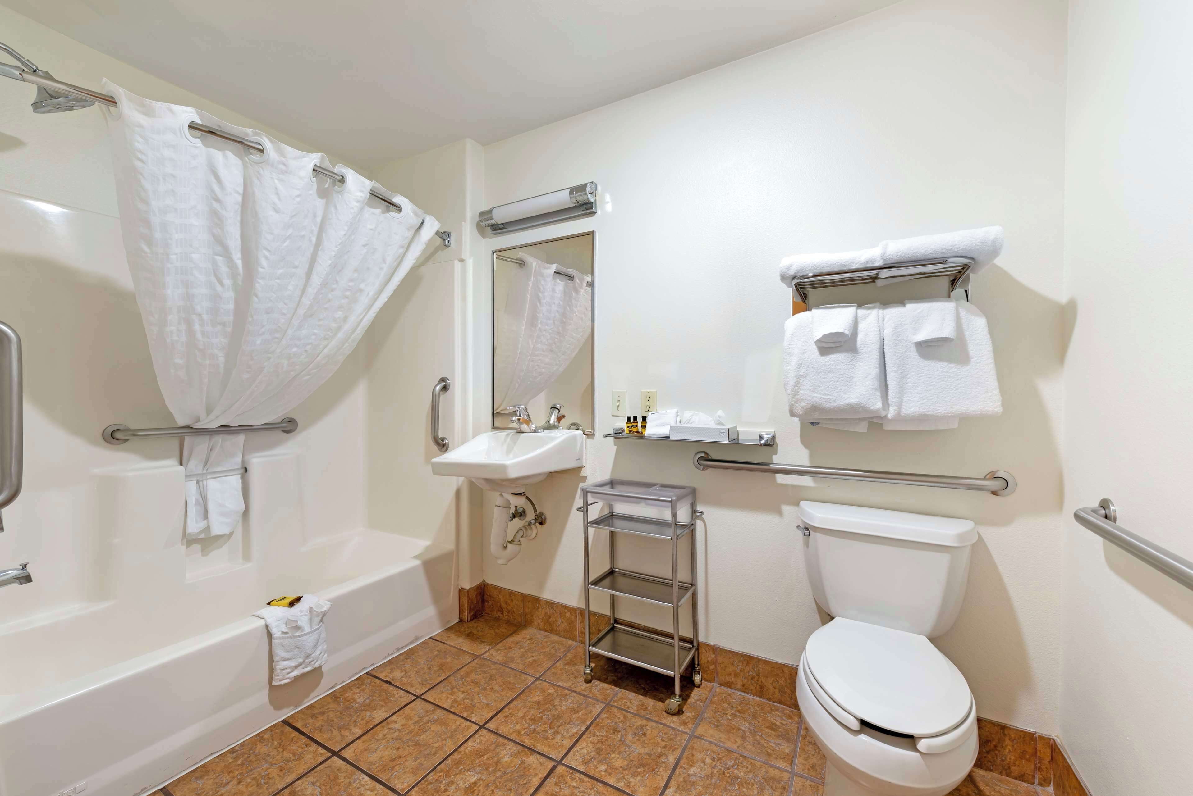 standard room, 2 queen beds, accessible, refrigerator & microwave | bathroom | combined shower/bathtub, designer toiletries, hair dryer, towels