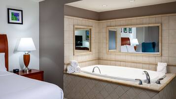 One King Bed | Bathroom | Combined shower/tub, free toiletries, hair dryer, towels