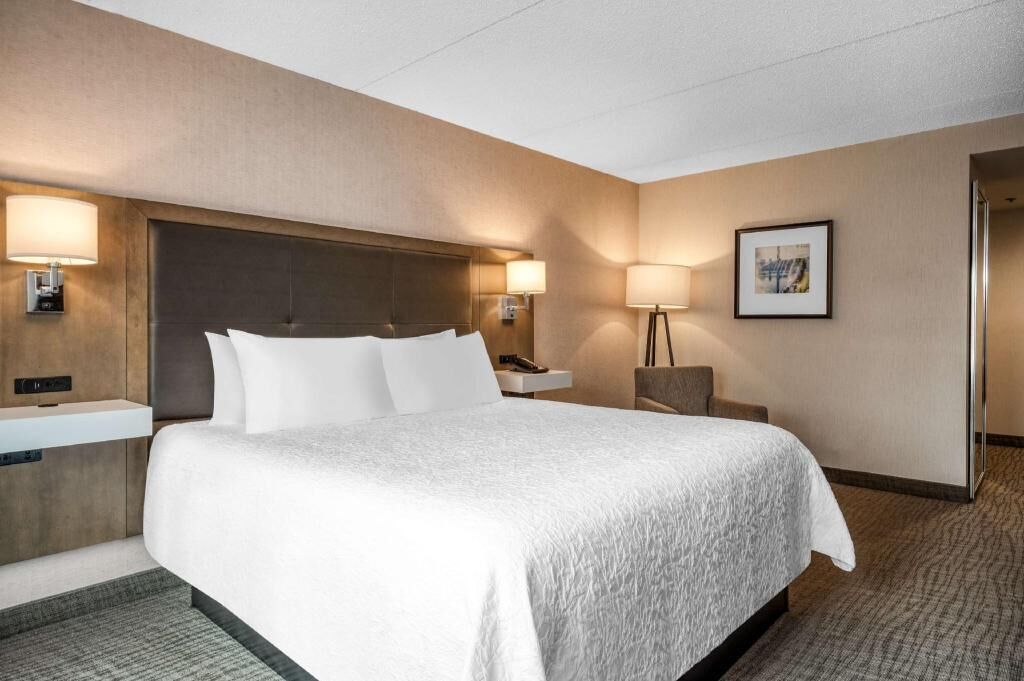 Premium bedding, desk, laptop workspace, blackout curtains