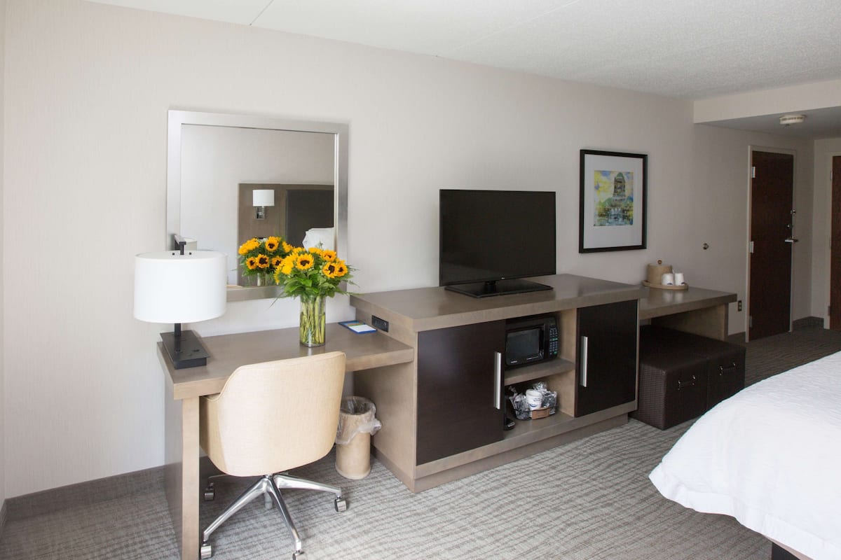 Premium bedding, desk, laptop workspace, blackout curtains