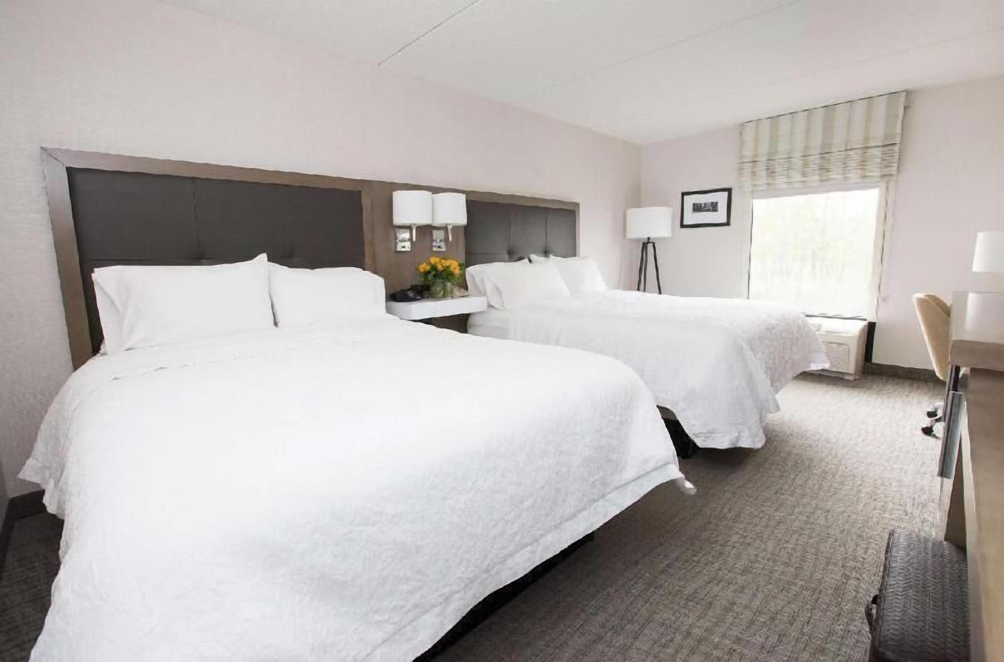 Premium bedding, desk, laptop workspace, blackout curtains