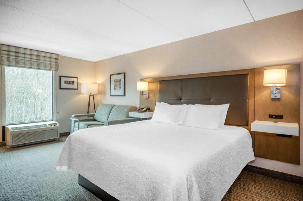Premium bedding, desk, laptop workspace, blackout curtains