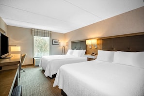Premium bedding, desk, laptop workspace, blackout curtains