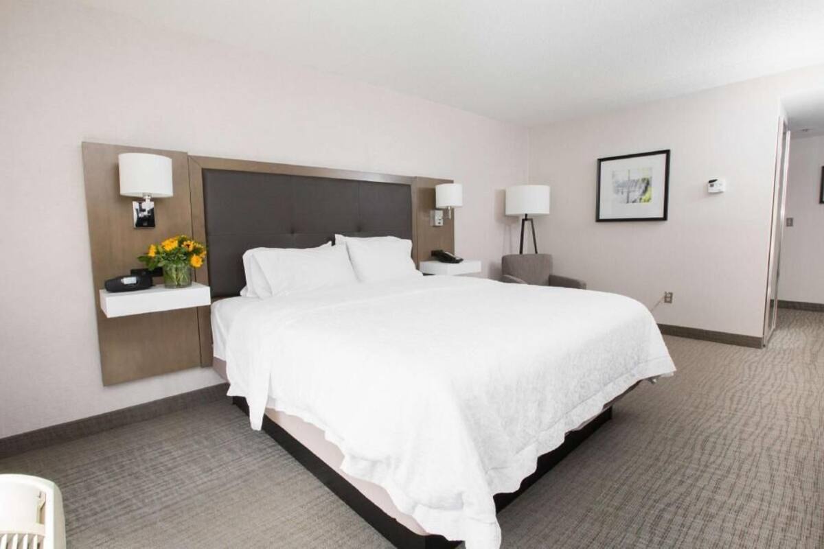 Premium bedding, desk, laptop workspace, blackout curtains