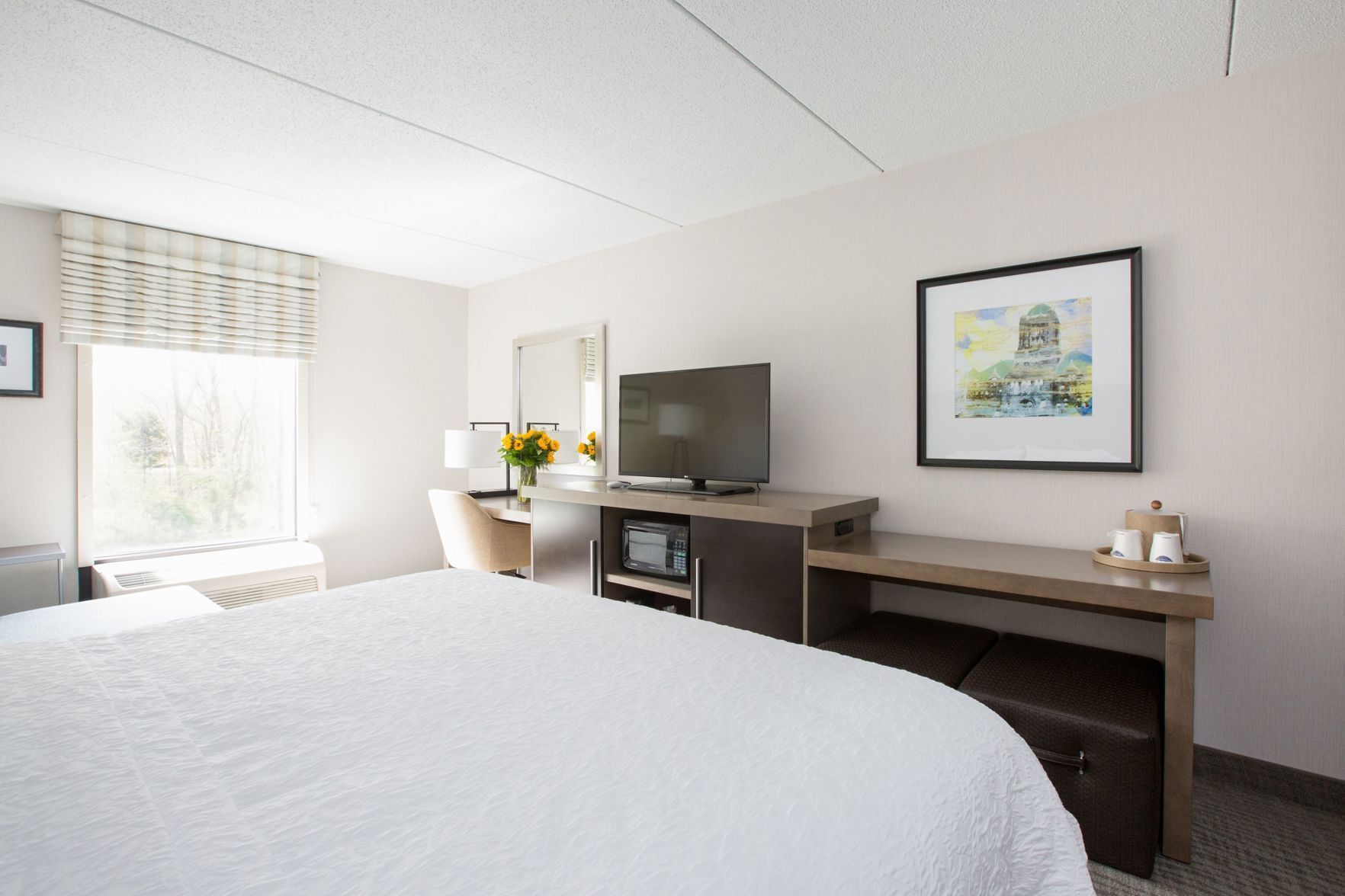 Premium bedding, desk, laptop workspace, blackout curtains