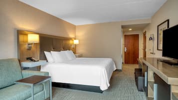 Room, 1 King Bed | Living area | 48-inch flat-screen TV with satellite channels, TV