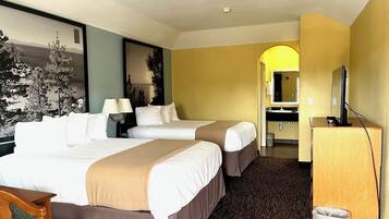 Desk, iron/ironing board, bed sheets, alarm clocks