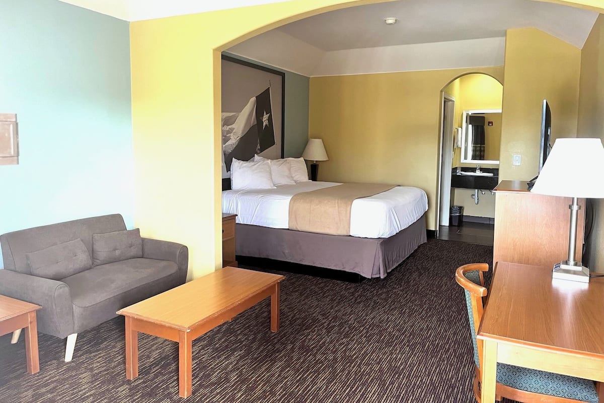 Desk, iron/ironing board, bed sheets, alarm clocks